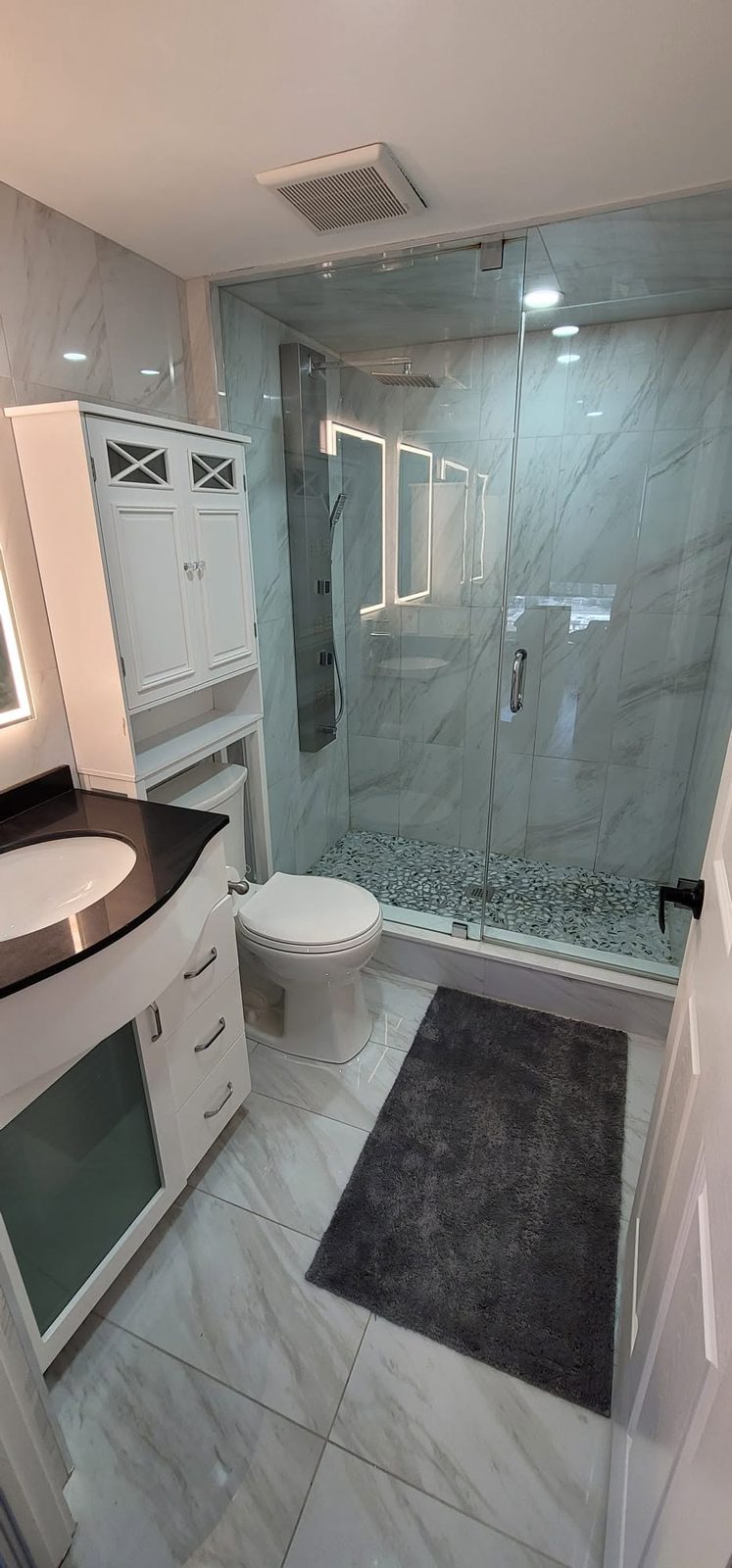 Condo bathroom with glass shower