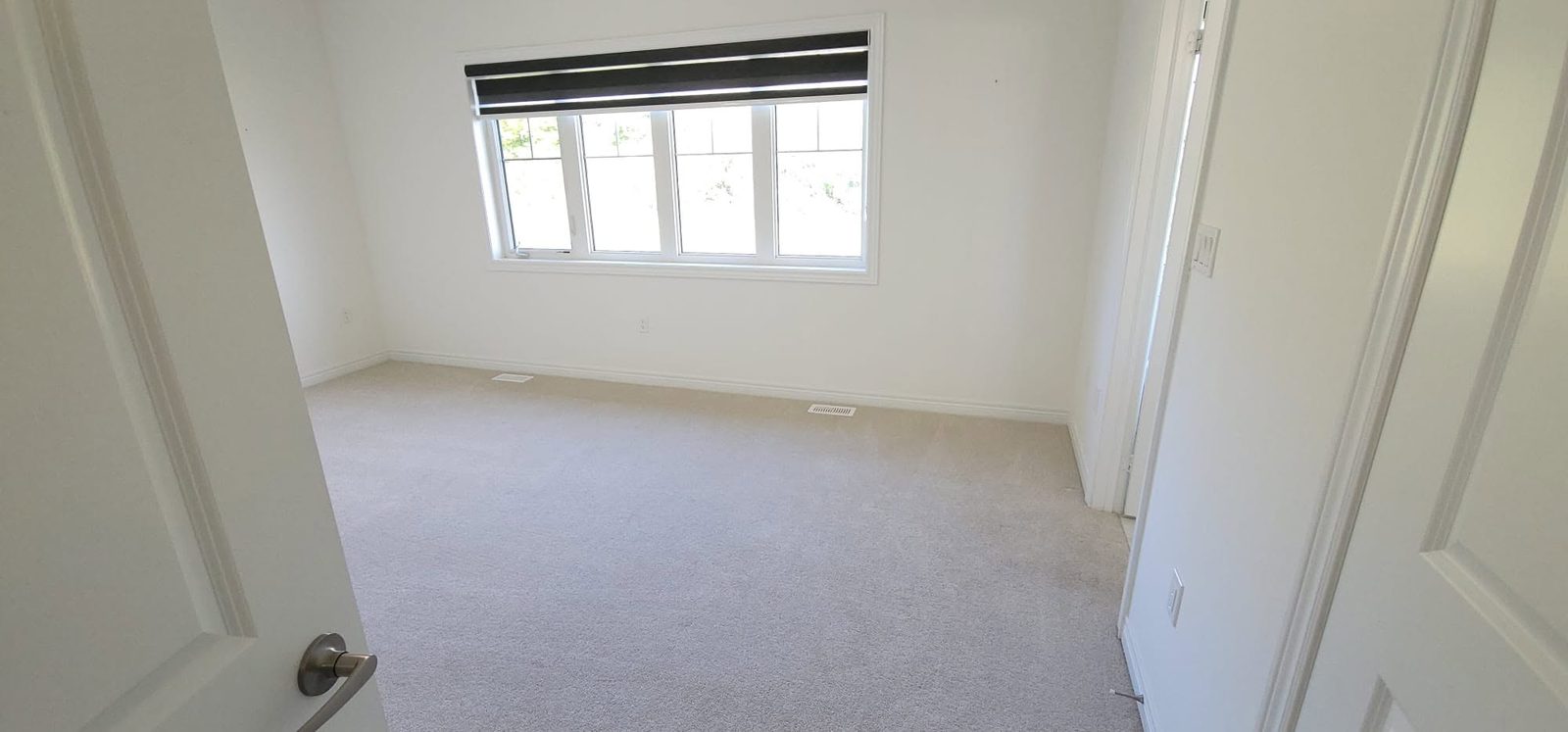 Bright bedroom with new carpet